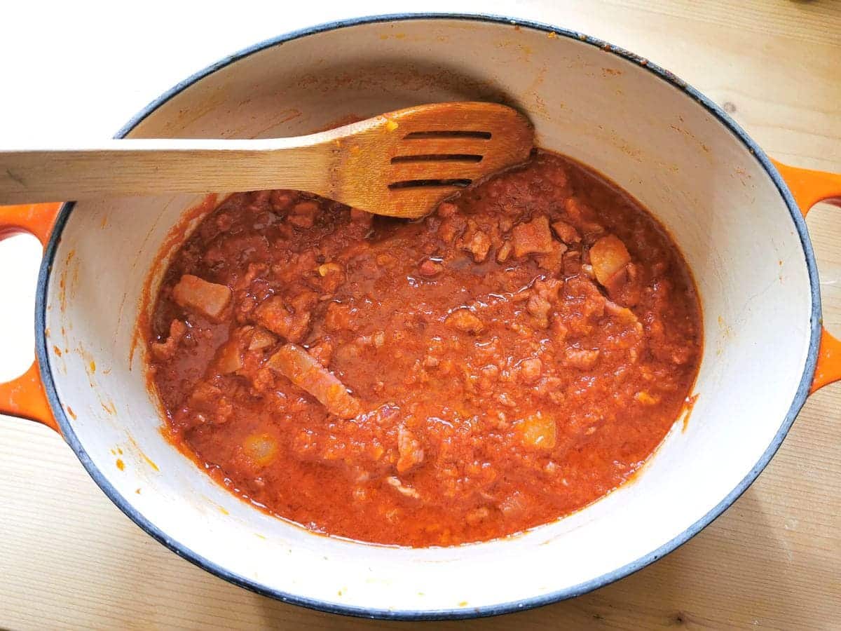 sauce with tomato passata added in Dutch oven