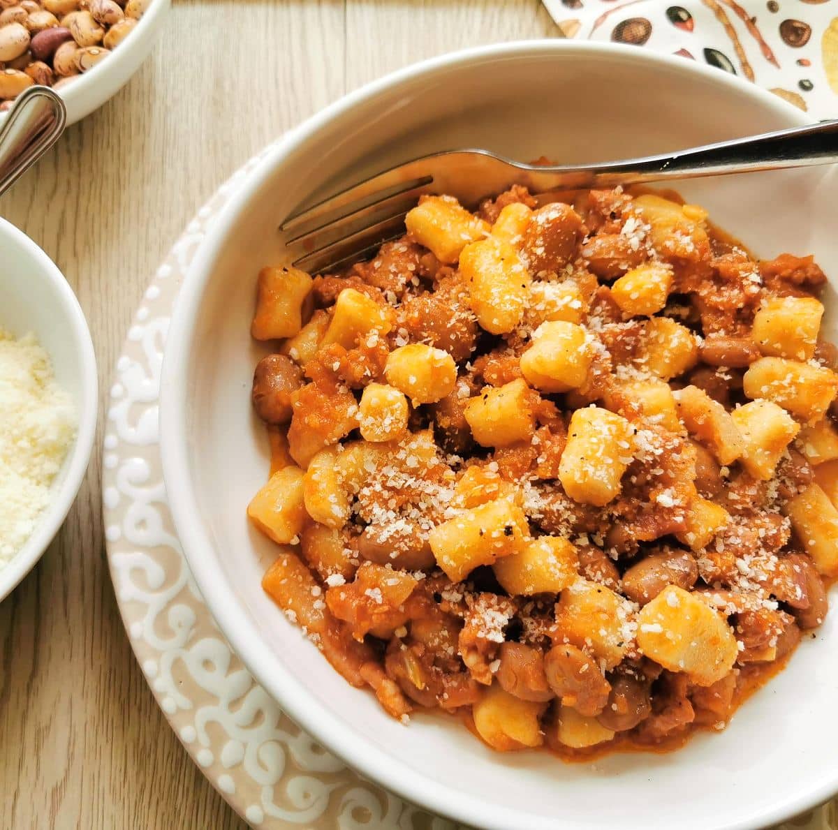 A bowl filled with breadcrumb gnocchi with sausage and beans (gnocchetti collescipolani) from Umbria.