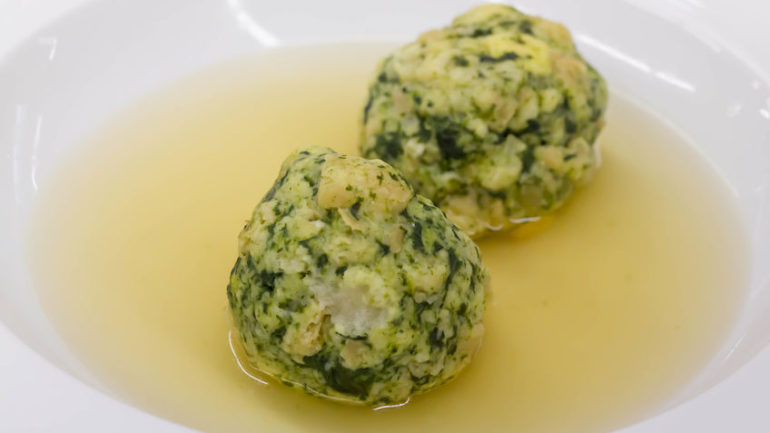 canederli made with spinach in clear broth