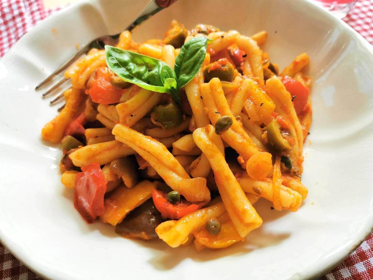 pasta caponata in white bowl.