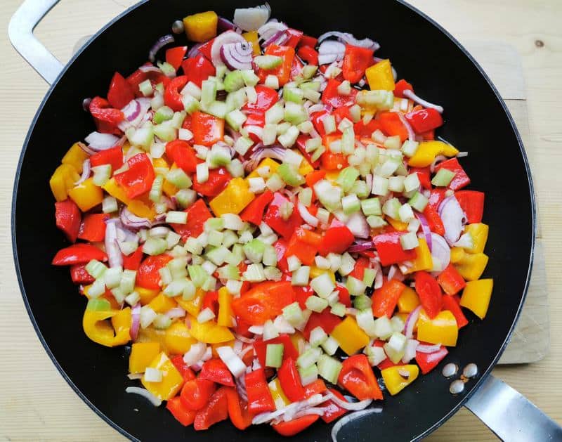 chopped red and yellow peppers, onions and celery in skillet.