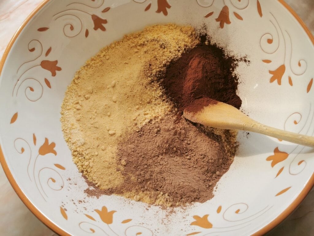 sugar and cocoa in bowl with crushed walnuts and breadcrumbs