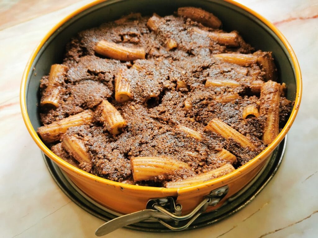 chocolate and walnut sweet pasta in cake tin