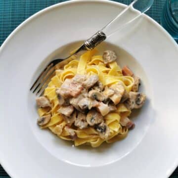 Creamy pork tenderloin pasta in a bowl.