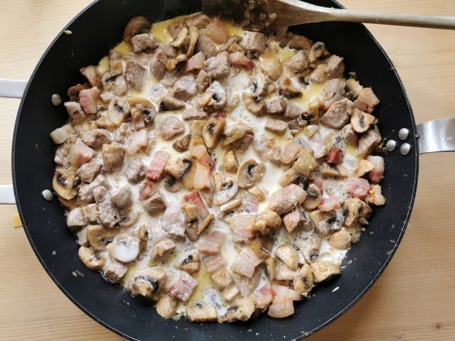 ready mushroom and pork fillet sauce in skillet