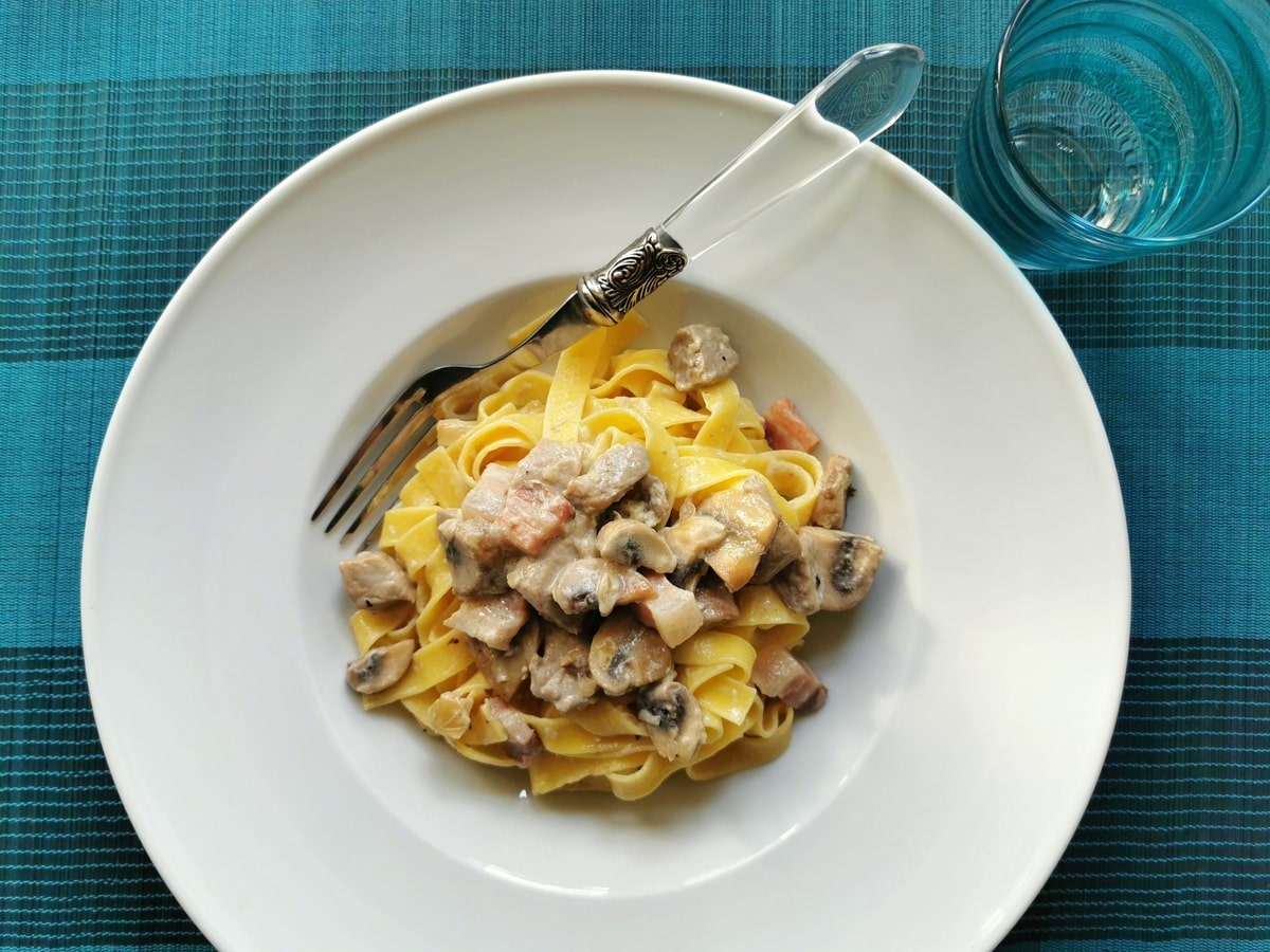 Creamy pork tenderloin pasta in a bowl.