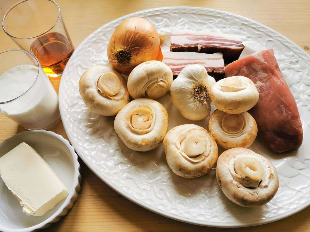 Ingredients for pork tenderloin sauce on white plate.