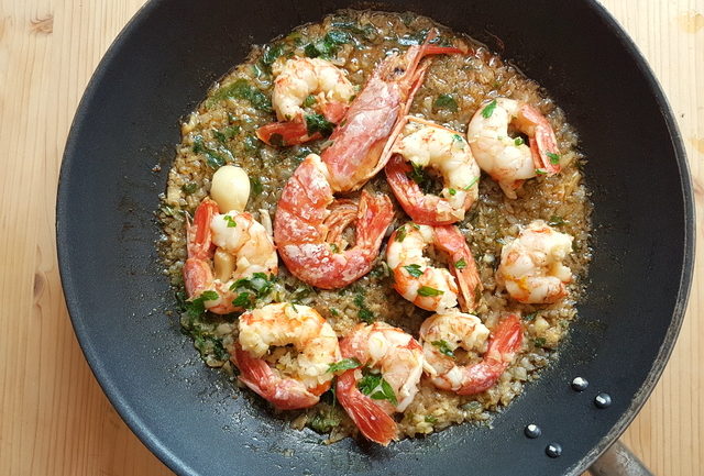 cooked prawns and sauce in frying pan for farfalle pasta with prawns and orange recipe