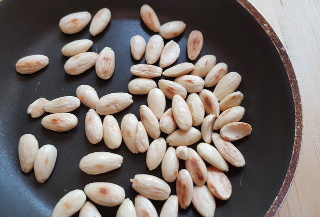 toasted almonds in frying pan