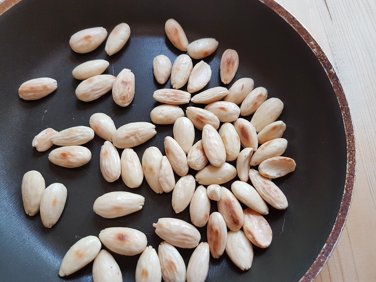 Toasted almonds in a pan.