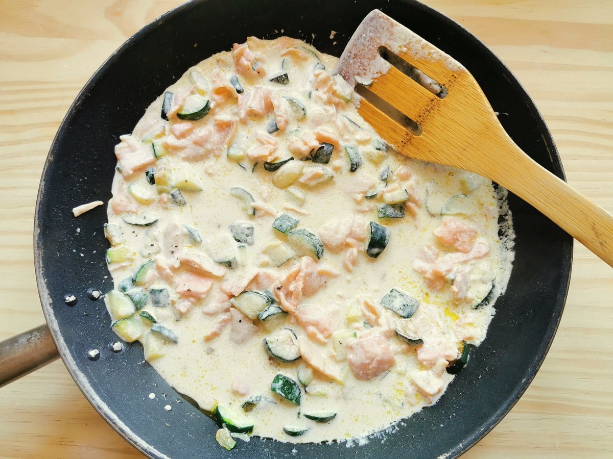 ready creamy smoked salmon and zucchini sauce in skillet