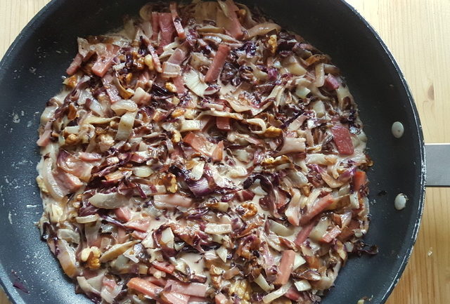 sauce in frying pan for pasta with speck and radicchio recipe