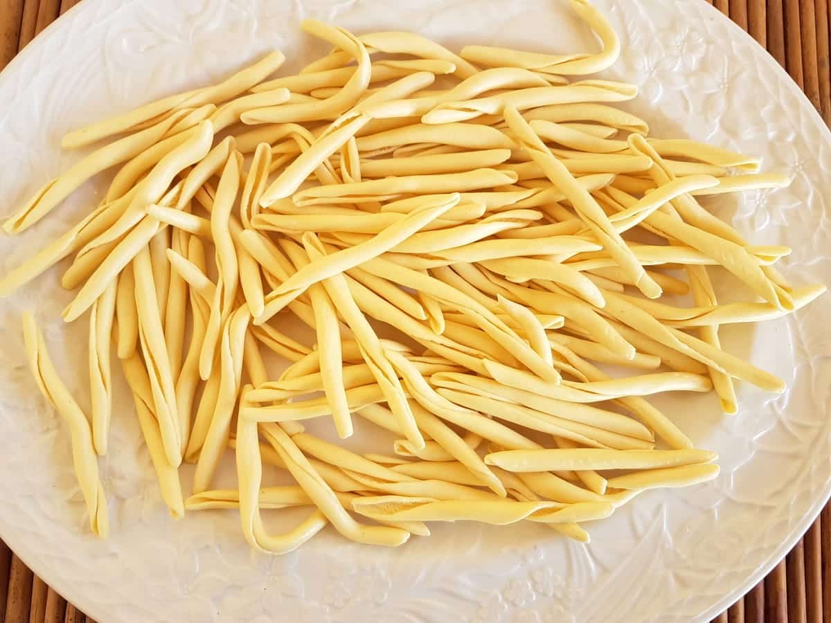 Dried fileja pasta from Calabria on white plate.