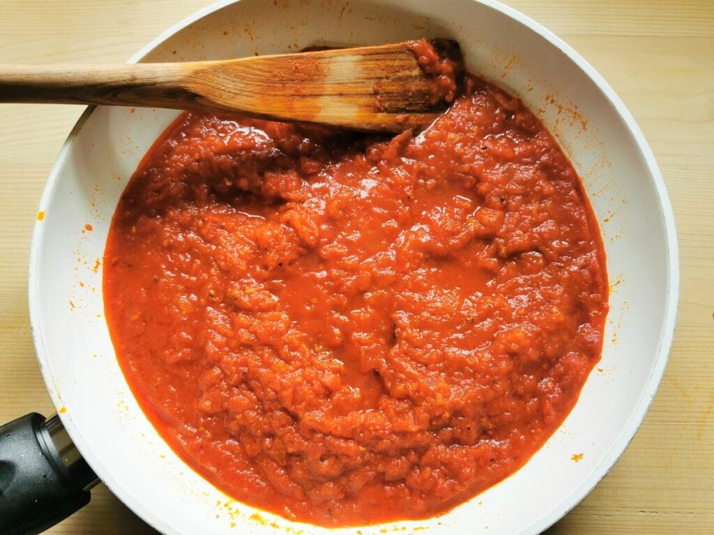 Ready nduja and tomato sauce in pan