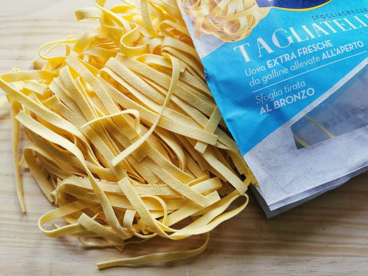 Fresh tagliatelle on a kitchen counter.