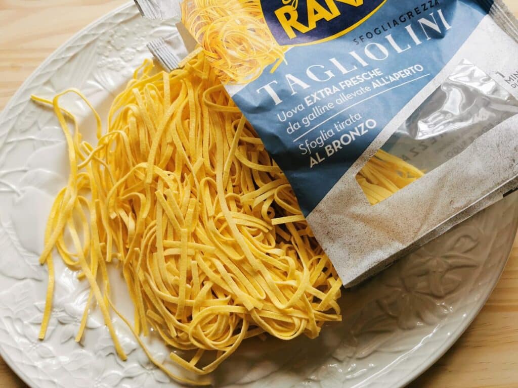 Fresh tagliolini from Giovanni Rana on white plate