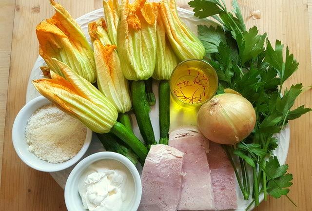 Ingredients for pasta with zucchini flowers, saffron and ham