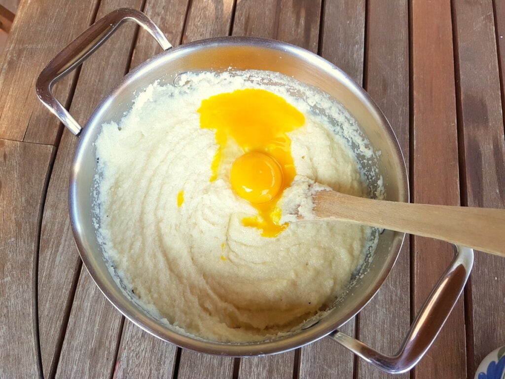 egg yolks in pan with cooked semolina