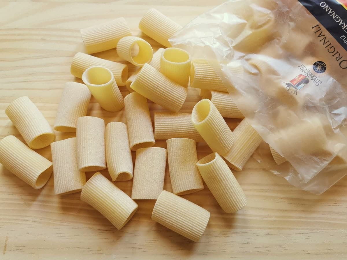 Paccheri with ridges on a kitchen counter.