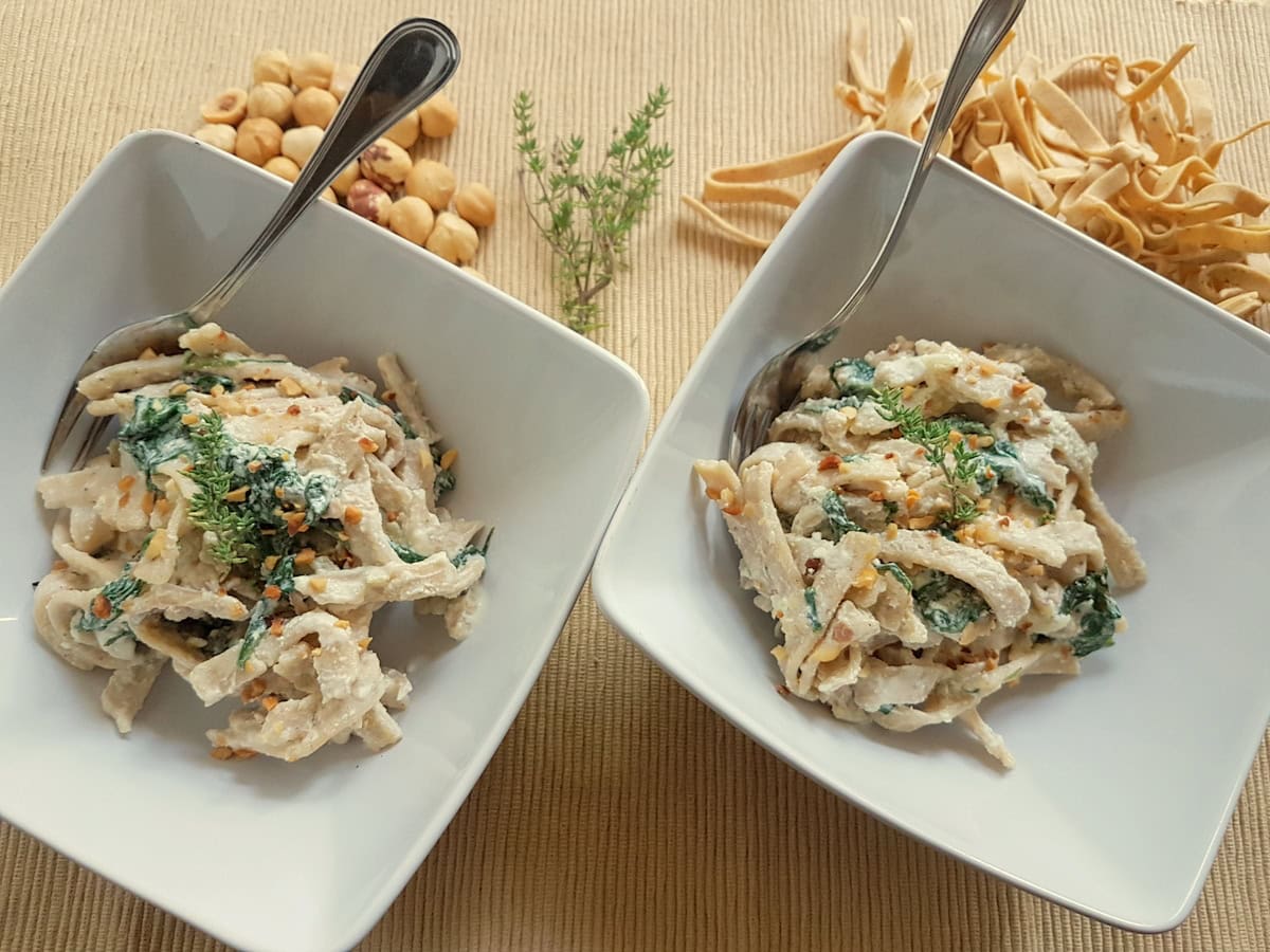 Hazelnut pasta with spinach and ricotta cream.