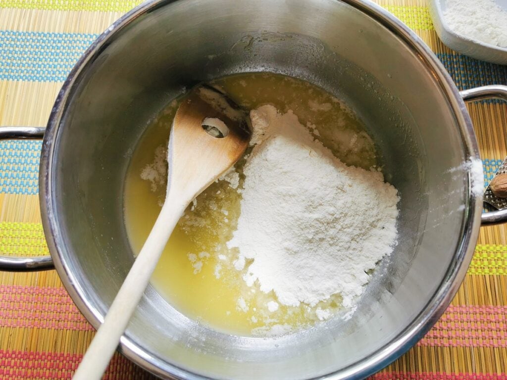 flour and melted butter in saucepan 