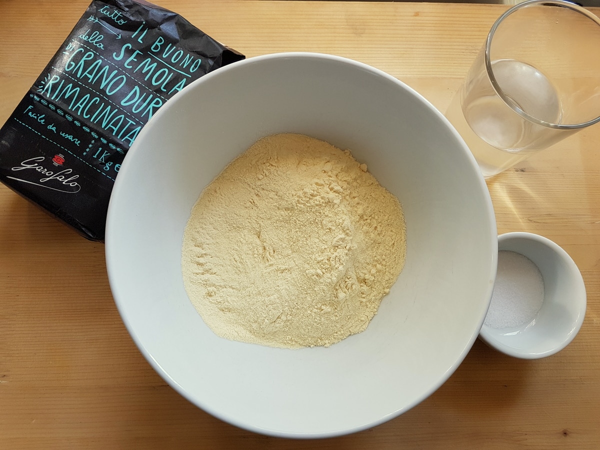 Homemade cavatelli ingredients on a kitchen table.