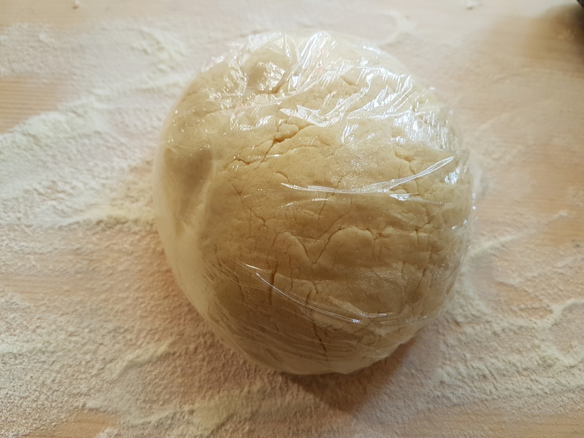 Cavatelli pasta dough in plastic wrap.