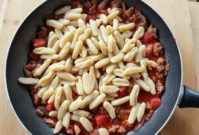 homemade cavatelli pasta with oyster mushrooms and sausage