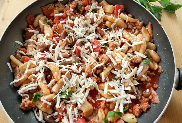 Homemade cavatelli with oyster mushrooms and sausage. 