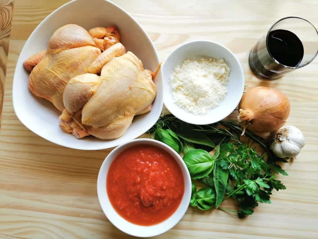 ingredients for free-range chicken ragu on wooden board