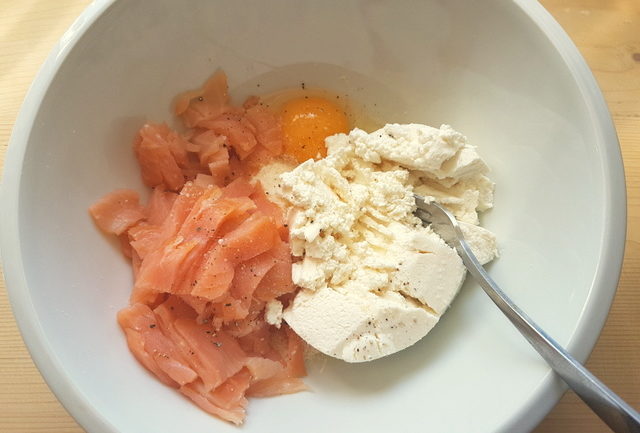 smoked salmon, ricotta, Parmigiano and egg in white bowl