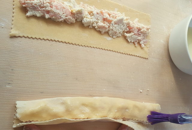 2 fresh pasta rectangles with smoked salmon filling