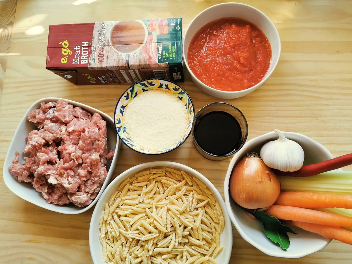 Lamb ragu with pasta ingredients on a kitchen table.