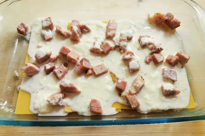 lasagna valdostana being prepped in a baking dish