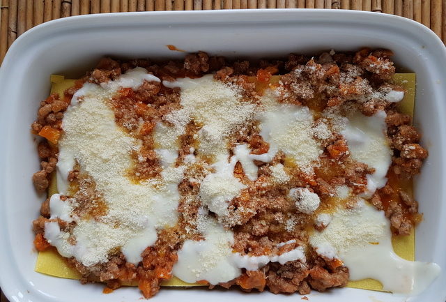 lasagne al forno with bolognese in white oven dish