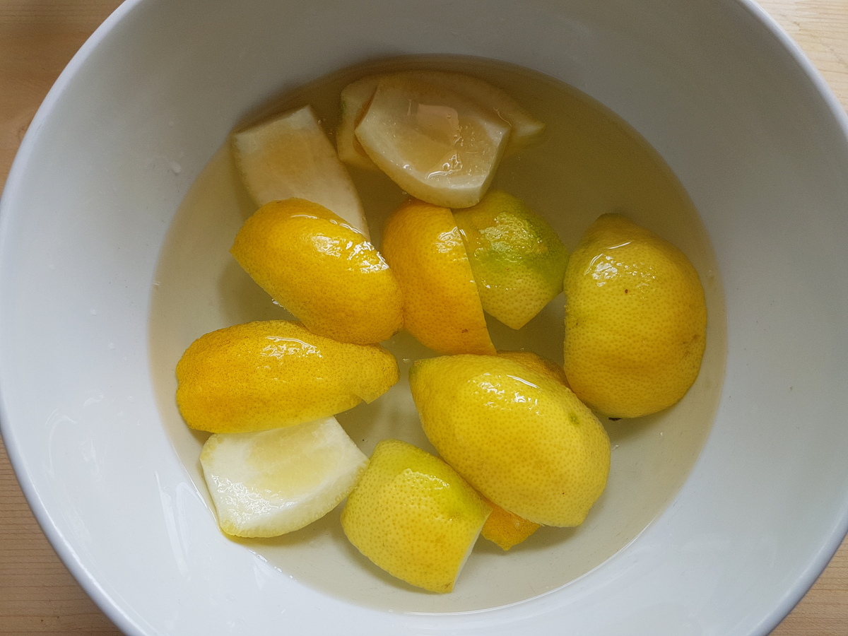 Lemon peels in a bowl of water.