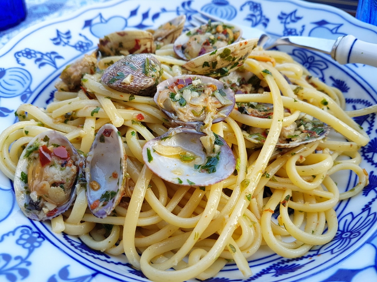 Linguine alle vongole topped with chilies.