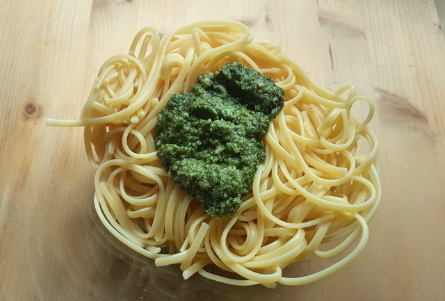 linguine pasta with mint pesto in glass bowl