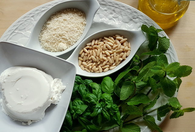 ingredients on white plate for linguine pasta with mint pesto and ricotta cream 