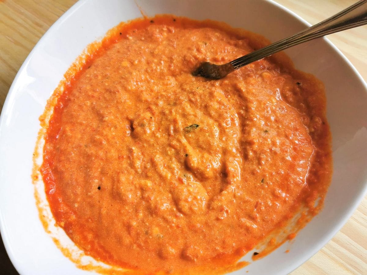 Pesto Calabrese being mixed in a bowl.