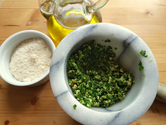 making pesto with a pestle and mortar