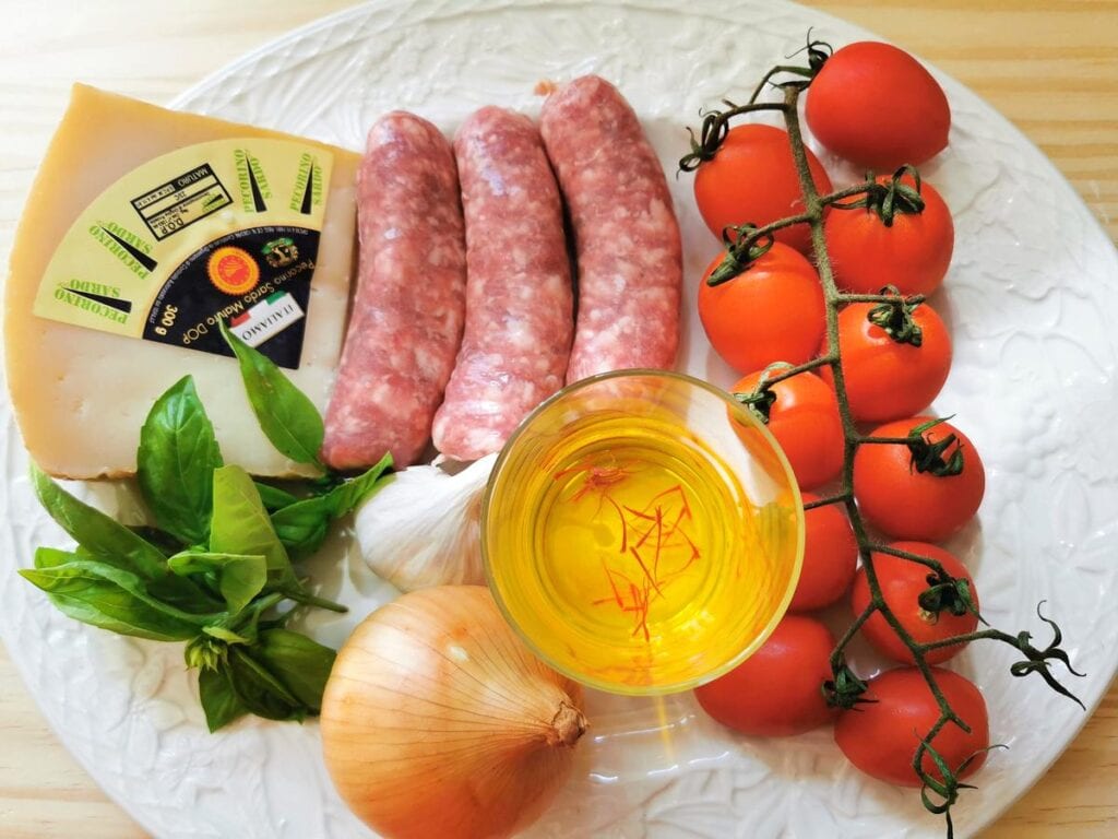 Ingredients for sausage, tomato and saffron sauce for malloreddus alla campidanese