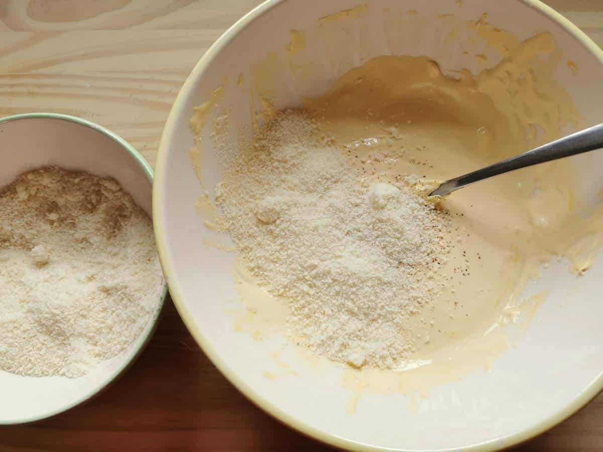 Mascarpone cream with grated grana in white bowl.