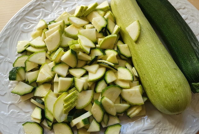 sliced white and green zucchini on a white plate