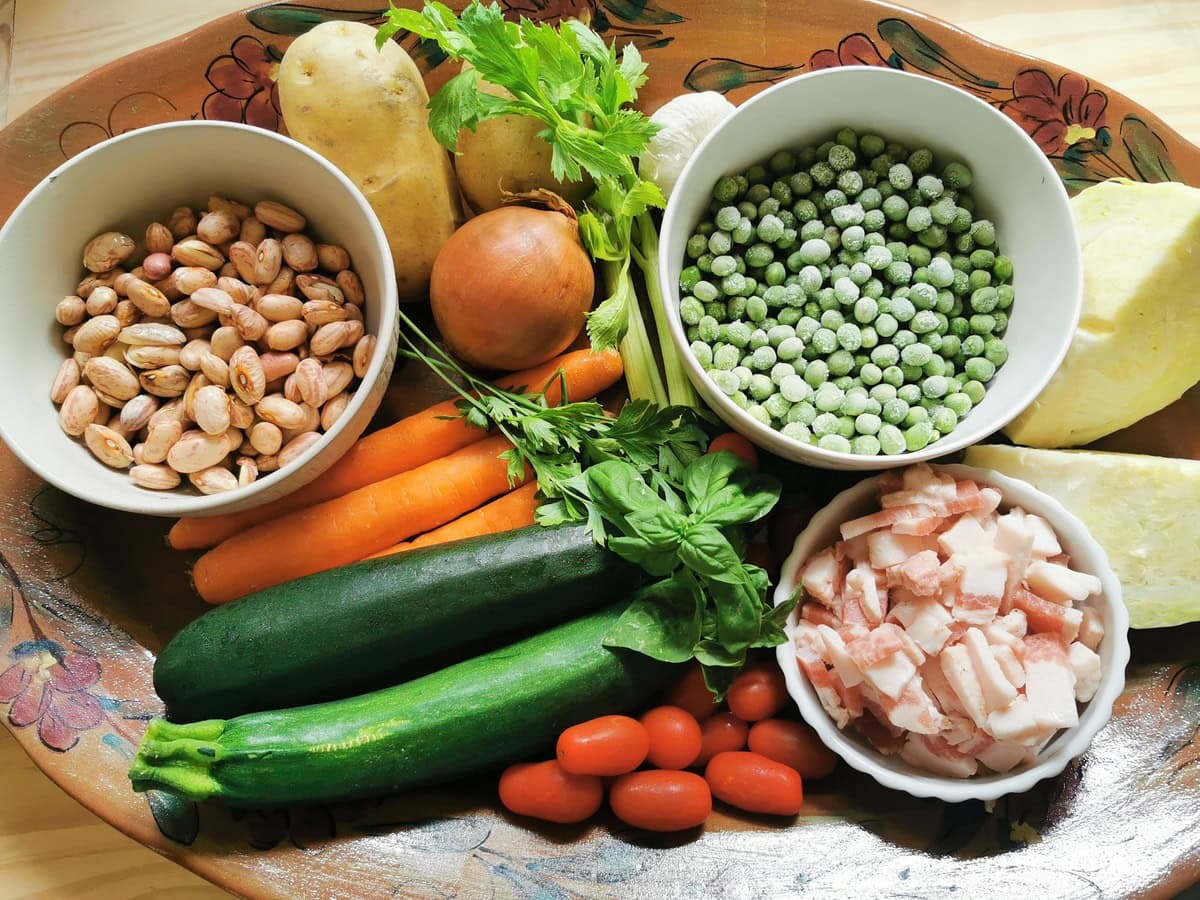 Ingredients for Milanese minestrone on large oval plate.