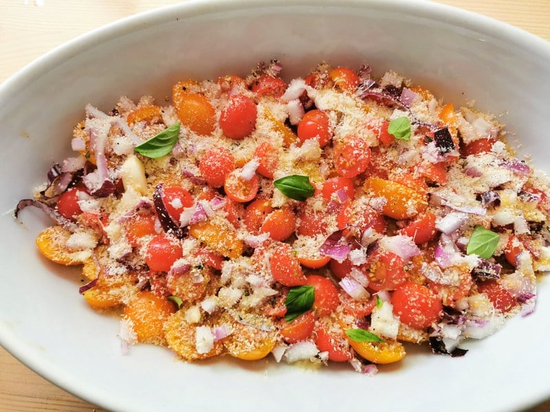 prepared condiment ingredients sprinkled with breadcrumbs and pecorino