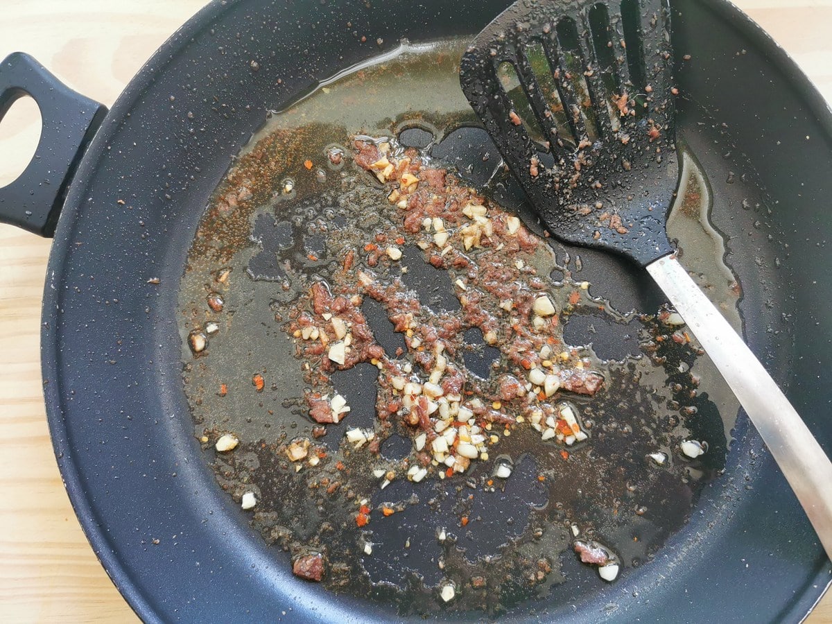 Anchovies that have dissolved into the olive oil.