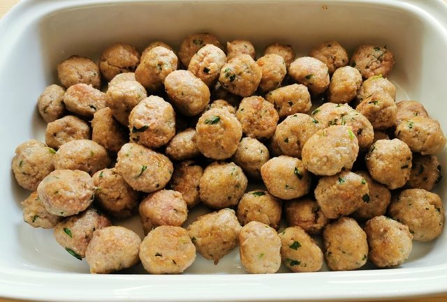 browned meatballs in white dish