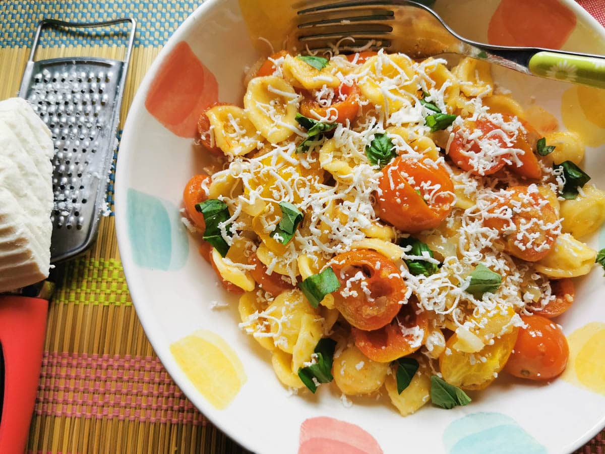 orecchiette pasta with roasted cherry tomatoes and grated ricotta salata
