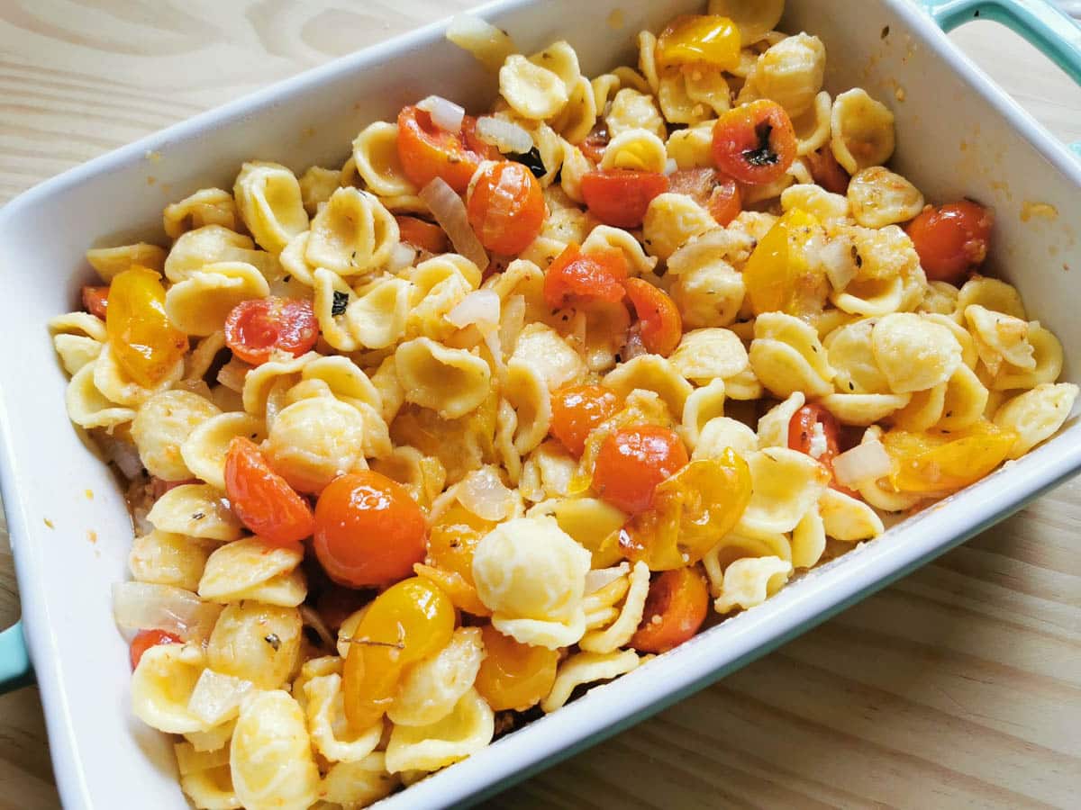 orecchiette pasta and cherry tomatoes in a baking dish